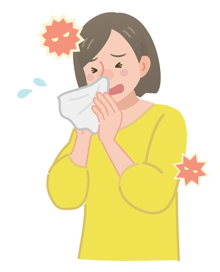 アレルギー性鼻炎でくしゃみをする女性